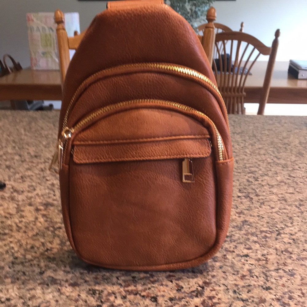 Brown Faux Leather womens small backpack.